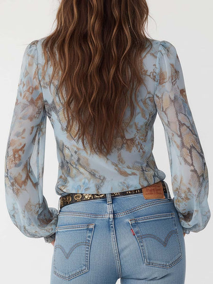 Arena | Blusa de gasa con volantes y cremallera frontal con estampado azul hielo