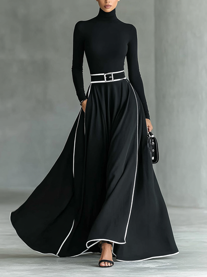 Gina – Vestido largo negro de mujer con costuras blancas, cuello alto, mangas largas y cintura ajustada