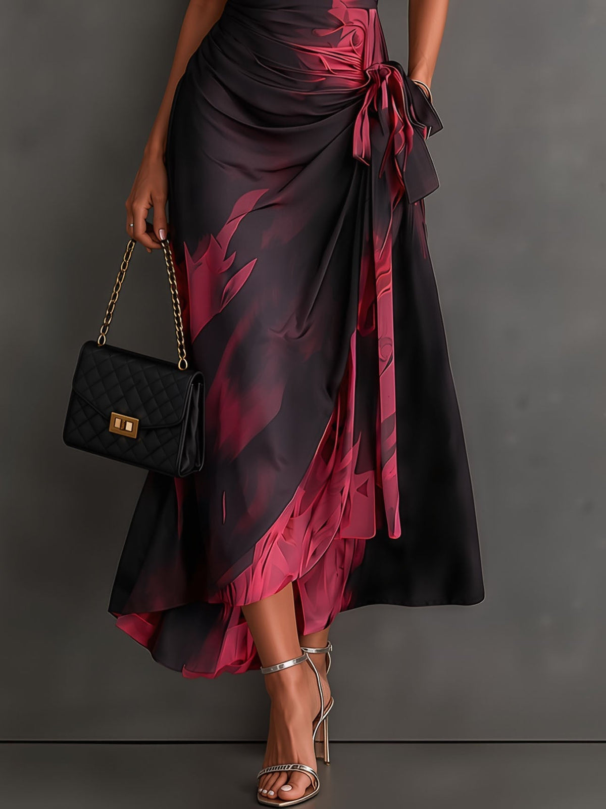 Vestido midi cruzado con estampado abstracto en rojo y negro, cuello en V, manga corta, lazo en la cintura y volantes en el bajo asimétrico
