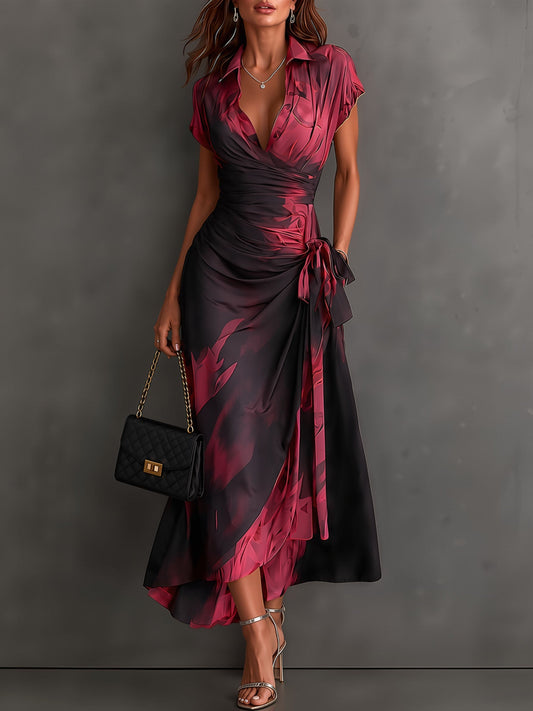 Vestido midi cruzado con estampado abstracto en rojo y negro, cuello en V, manga corta, lazo en la cintura y volantes en el bajo asimétrico